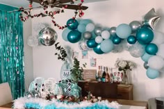 a room with balloons and decorations on the wall