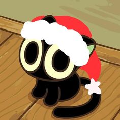 a black cat wearing a santa hat sitting on top of a wooden floor next to a wall