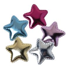 three shiny stars are shown in different colors