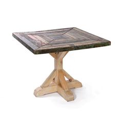 a wooden table with an interesting design on it's top and legs, made out of wood