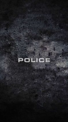 the word police is written in white on a black background with some spots and scratches