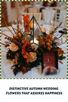 an image of a table setting with flowers on it and the words distinctive autumn wedding flowers that assures happiness