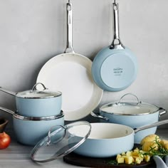 an assortment of pots and pans on a table