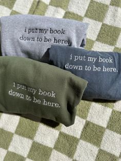 three pillows that say i put my book down to be here