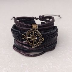 Embrace the allure of the unknown and showcase your adventurous side with our Multilayer Compass Pirate Bracelet. With its striking design and adjustable size, this accessory invites you to chart your own course in style. So, set sail on a journey of self-expression and discovery. Product Information *Set contains 3 separate bracelets *Adjustable length:       7 - 8.5 inches (fits most adults)      6 inches  *Metals Type: alloy *Materials: faux leather, leather *Adjustable: Sliding lock *Men's, Pirate Jewelry Bracelets, Pirate Accessories Aesthetic, Ren Fest Jewelry, Pirate Aesthetic Jewelry, Pirate Clothes Aesthetic, Pirate Accessories Women, Black Bracelet Jewelry For Outdoor, Black Outdoor Bracelet Jewelry, Adjustable Bohemian Jewelry For Outdoors