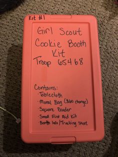 a pink box with writing on it that says girl scout cookie booth trip 65th8