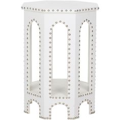 a white side table with rivets on it