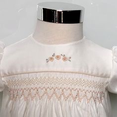 Traditional genuine hand smocking and soft rosebud embroidery in ecru and blush tones make this ivory baby 'day' dress a lasting classic for your little girl and to hand down.     Each dress is hand smocked and embroidered so each is unique with minor variations in embroidery and smocking design, as you would expect from a hand crafted garment. This day dress is perfect for a wedding, baptism or other special occasion, or any day you just want to dress your little princess up.    Size 000 : Fits approx 0 to 3 months - chest up to 44cm - measures 36cm from shoulder to hem. Size 00 : Fits approx 4 to 8 months - chest up to 46cm - measures 39cm from shoulder to hem. Size 0 : Fits approx 9 to 12 months - chest up to 49cm - measures 42cm from shoulder to hem. Size  1: Fits approx 12 to 18 month Rosebud Embroidery, Smock Dress Pattern, Hand Smocking, Rose Dans, Blush Tones, Hand Smock, Special Occasion Dress, Lace Edging, Smock Dress