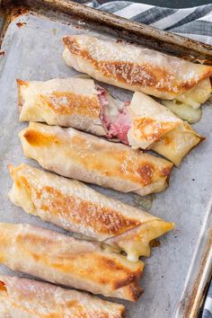 some food is sitting on a baking sheet and ready to be cooked in the oven