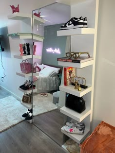 a room that has some shelves with shoes on it