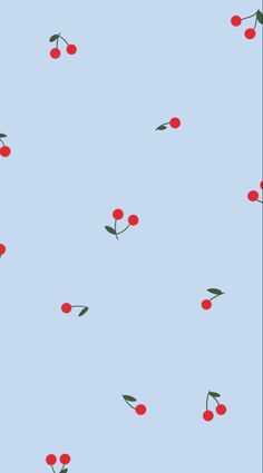 a blue background with red cherries and green leaves on the top of each branch