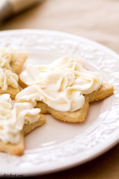 some cookies with icing on a white plate