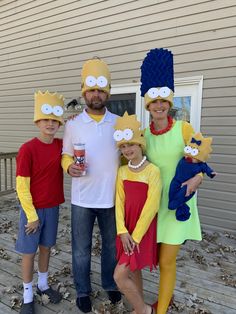 the family is dressed up in costumes for halloween