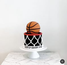 a birthday cake with a basketball on top