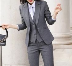 This unique ladies suit is designed with high quality wool material that guarantees durability and comfort. It is suitable for all kinds of occasion and it can be worn all year round. It comes in 3 pieces ( Jacket + Vest + pant) the blazer can also be worn with any kind of trouser or jeans  For custom orders, Please feel free to start a  conversation for further enquires. Your satisfaction is our priority Female Pant Suit Wedding, 3 Pieces Suit Woman, Women’s 3 Piece Suit, Winter Business Blazer, Winter Workwear Sets In Suiting Fabric, Tailored Winter Suits For Business Meetings, Winter Tailored Three-piece Suit For Office, Winter Workwear Sets With Suit Collar, Winter Office Blazer In Suiting Fabric