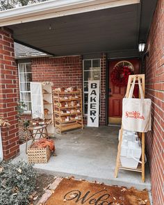 a red brick building with an entry way and sign