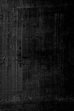 an abstract black and white background with scratches