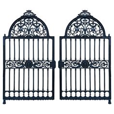 two black wrought iron gates on white background