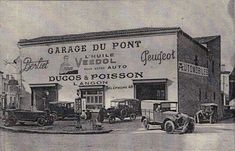 an old black and white photo of cars parked in front of a building with the words garage du point written on it