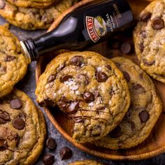 chocolate chip cookies in a wooden spoon with a bottle of beer