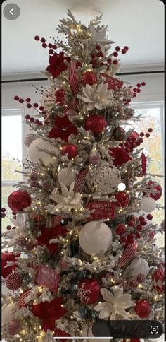 a christmas tree decorated with red and white ornaments