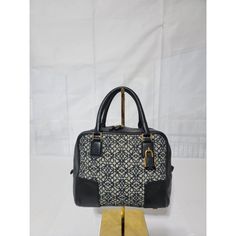 This Authentic Loewe Jacquard Anagram Calfskin Amazona 19 Black Navy Bag Is In It’s Good Pre-Owned Condition The Exterior Is Clean And Beautiful , The Interior Is Clean And Beautiful. It's A Beautiful Small Bag. No Longer Strap Pictures On Mannequin Is Not Ours But For Size Reference Only And Fit. Size Base Length: 9.5 In Height: 6 In Width: 4 In Drop: 1.5 In Loewe Bags, Navy Bag, Loewe Bag, Navy Color, Small Bag, Black And Navy, Calf Skin, Black And Grey, Bag Lady