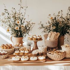 a table topped with lots of desserts and flowers