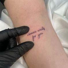 a woman's arm with a tattoo that reads, virginia waits for you