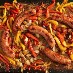 sausages and peppers are being cooked in a pan