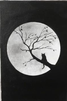 a black and white photo of a cat sitting on a tree branch in front of a full moon