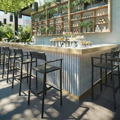 an outdoor bar with lots of chairs and plants on the back wall, along with shelves full of bottles