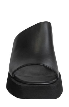 A soft leather slide sandal offers sophisticated style with an architectural vamp lifted by a wedge heel. 2" heel; 1/2" platform Leather upper/synthetic lining and sole Imported Boho Lifestyle, Ankle Wrap Sandals, Drop Box, Wardrobe Update, Womens Sandals Wedges, Leather Slide Sandals, Slip On Mules, Black Wedge Sandals, Body Systems