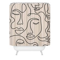 a shower curtain with a black and white line drawing of faces on the outside of it