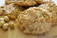 some cookies and nuts are on a cutting board