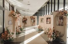 the hallway is decorated with flowers and pictures