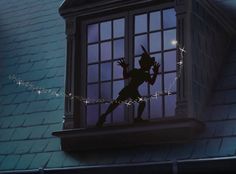 the silhouette of a woman standing on top of a window sill in front of a night sky