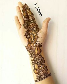 a hand that has some henna on it