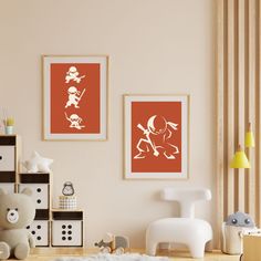 there are two pictures hanging on the wall in this child's room, one is orange and the other is white