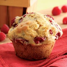 a muffin sitting on top of a red cloth