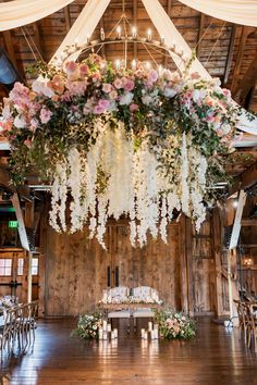 an overhead floral arrangement hangs from the ceiling