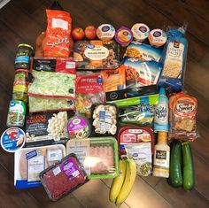 an assortment of food is laid out on the floor