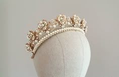 Bridal flower tiara with pearls and crystals, wedding kokoshnik Also available in silver tone or with other color of crystals and pearls (in menu) ~MATERIALS~ -Czech glass crystals (color White clear) -Austrian white pearl beads -Gold tone filigree ~SIZE~ Height 1 1/2 inch (4,5 cm) ~SHIPPING AND DELIVERY TIME~ This headpiece is ready to ship by 5-7 days The approximate time of shipment: - 10-16 days to Europe - 15-35 days to United States and other countries. ~IMPORTANT INFORMATION~ -Please allo Flower Tiara Wedding, Gold Flower Crown, Tiara Gold, Pearl Crown, Flower Tiara, Crown Gold, Pearl Tiara, Tiara Wedding, Gold Tiara