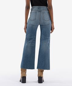 Effortlessly cool with a vintage vibe, these stretchy wide-leg jeans feature patch pockets, raw-cropped hems and trendy exposed front buttons. Fabric: 53% Cotton, 29% Lyocell, 17% Polyester, 1% Spandex Size & Fit: Inseam: 29 1/2", Leg Opening: 23", Rise: 10 1/2" Color: PREVENT W/MED BASE WASH Model Info: Model is 5'9" and wearing a size 0; Waist 24", Hips 35" Children Bottoms, Vintage Vibe, High Rise Shorts, Wide Leg Denim, Denim Pant, White Denim, Comfortable Fashion, Wide Leg Jeans, Black Denim