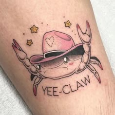 a crab wearing a pink hat with the word yee claw on it's leg