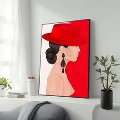 a woman wearing a red hat and earrings on a shelf next to a potted plant