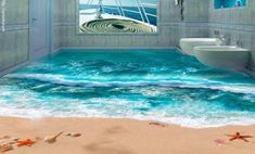 an ocean themed bathroom with blue water and starfishs on the beach, as well as a toilet