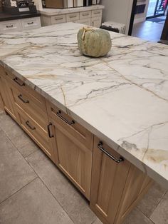 a large marble counter top in a kitchen