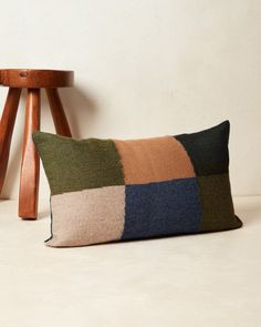 a pillow sitting on top of a wooden chair