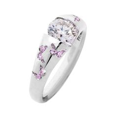 a white gold ring with pink diamonds