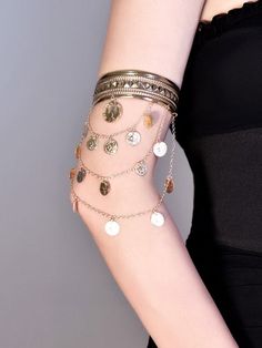 Elevate your cyberpunk style with our silver/gold chains arm cuff. This statement piece features intricate chain detailing, adding an edgy and futuristic touch to your look. Available in both silver and gold finishes, this arm cuff is perfect for adding a bold accent to any outfit. Embrace the cyberpunk aesthetic and stand out from the crowd with this eye-catching arm cuff.   Please note that this product includes only one arm cuff. Trendy Gold Metal Body Jewelry, Elegant Silver Brass Body Jewelry, Gold Metal Chain Bracelet For Festival, Festival Metal Chain Bracelet With Adjustable Chain, Gold Chain Cuff Bracelet In Metal, Gold Chain Bracelet For Festival, Adjustable Metal Chain Bracelet For Festivals, Bohemian Metal Chain Bracelet For Festivals, Gold Festival Bracelet Body Jewelry